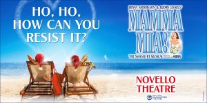 A vibrant scene from Mamma Mia! featuring actors in colourful costumes performing energetically on stage.