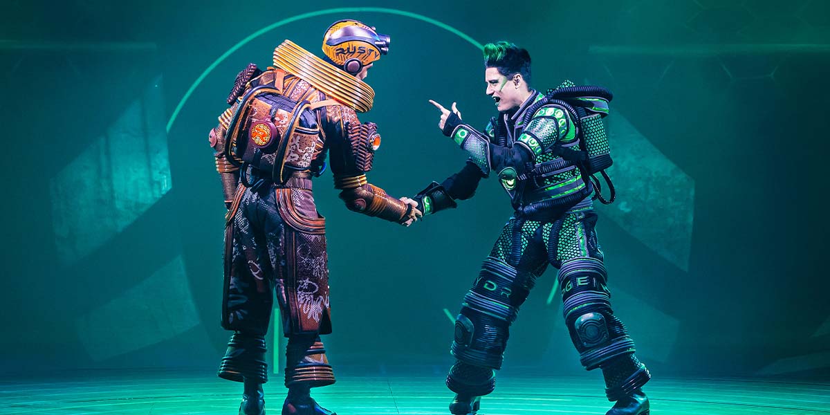 A vibrant scene from Starlight Express featuring performers in colourful costumes on roller skates.