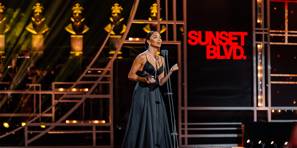 Nicole Scherzinger accepting an Olivier Award on stage at the Royal Albert Hall.