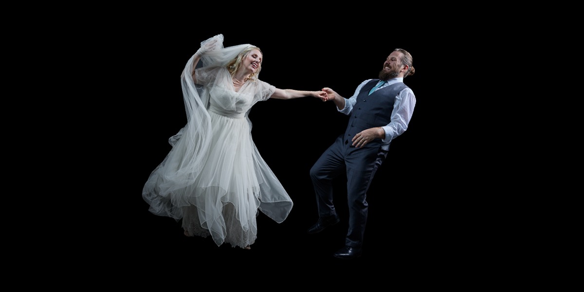 A bride and groom dancing.