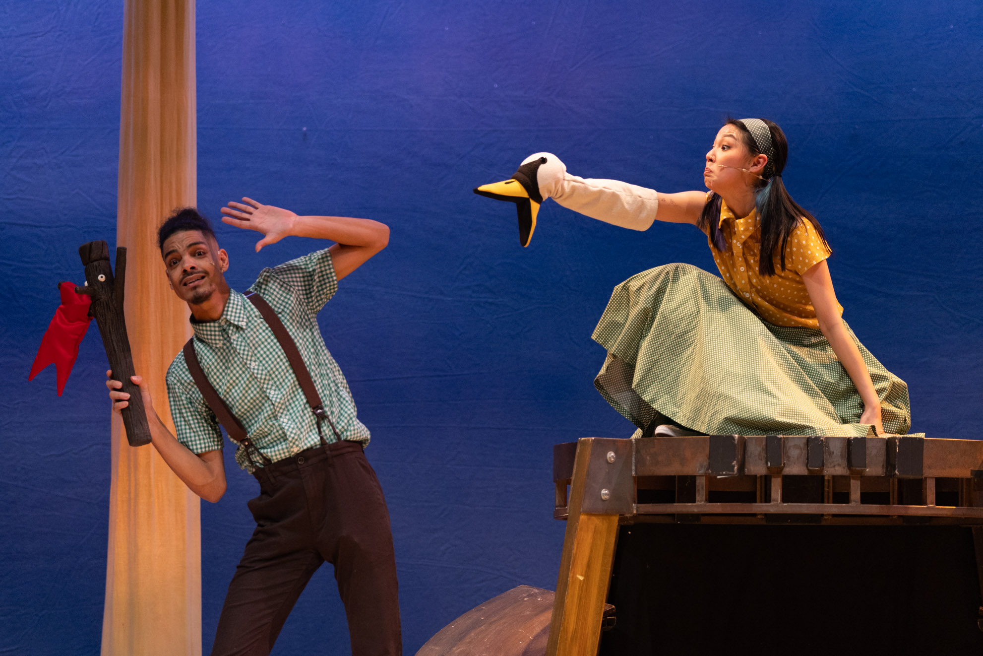 A stick figure stands upright on a textured surface, with a simple smile and outstretched arms.