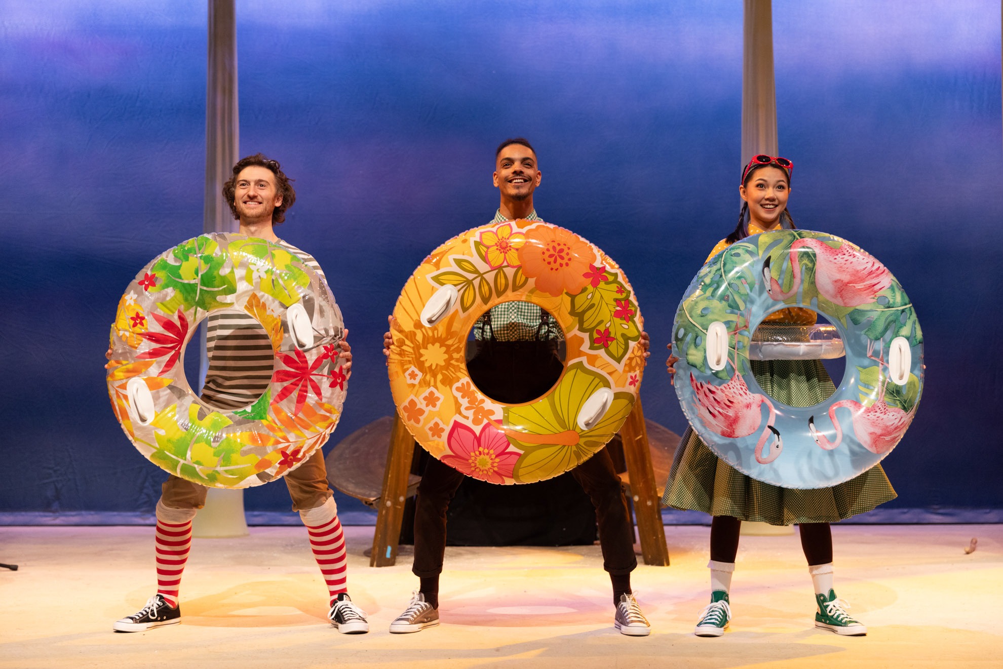 A stick figure stands on a textured surface, arms raised, against a plain white background.