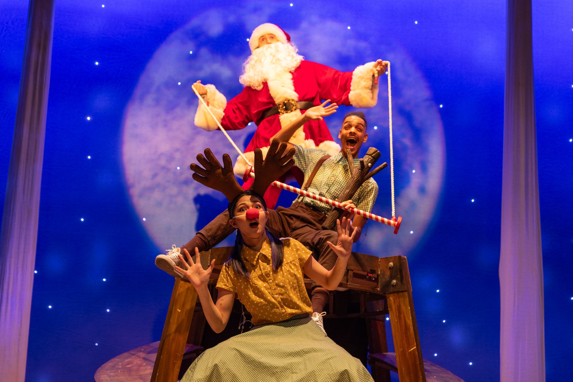 A stick figure stands upright on a textured surface, with a simple smile and outstretched arms.