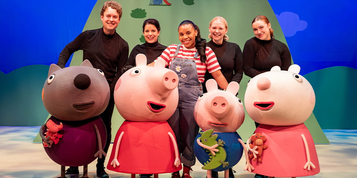 The cast of Peppa Pig's Big Family Show, including David Tudor, Emma Hilts, Cinem Gopaul, Charlie Culkin, and Cate Brooks, poses together.