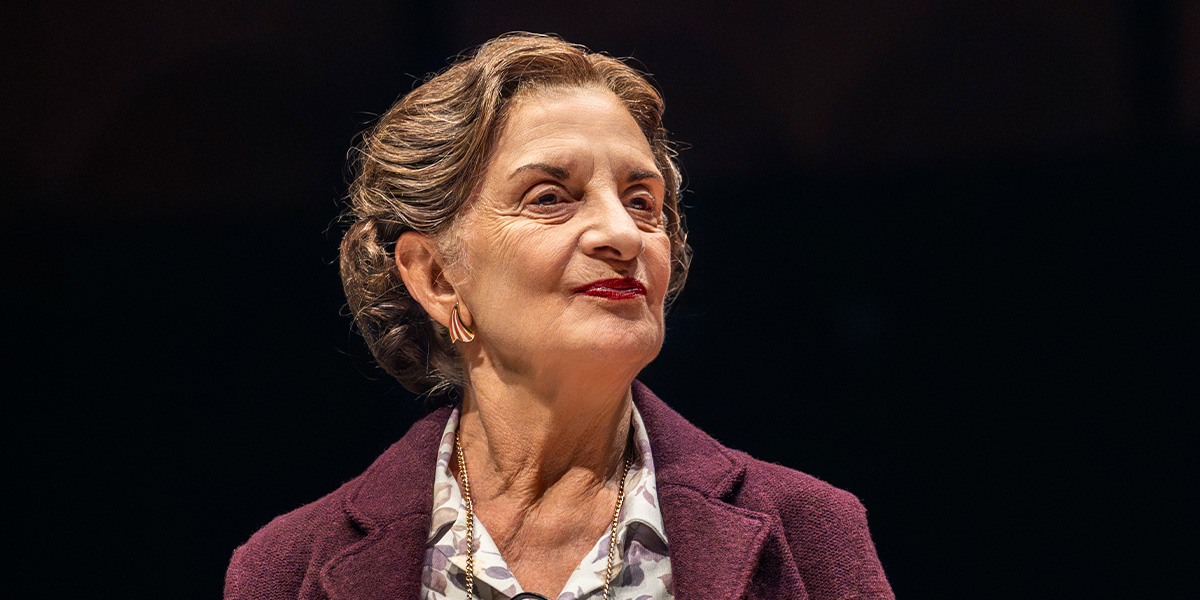 Norma Atallah performs on stage in a dramatic scene from John le Carré's The Spy Who Came In From The Cold.