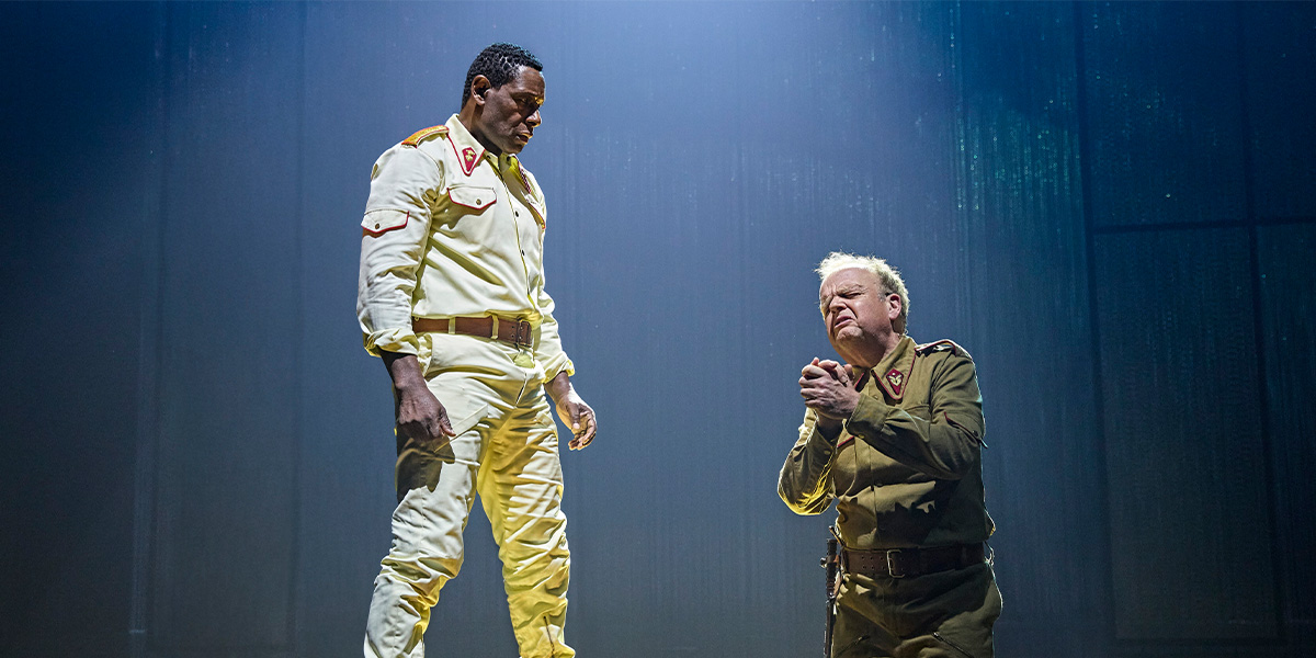 David Harewood as Othello and Toby Jones as Iago, in a dramatic pose on stage.