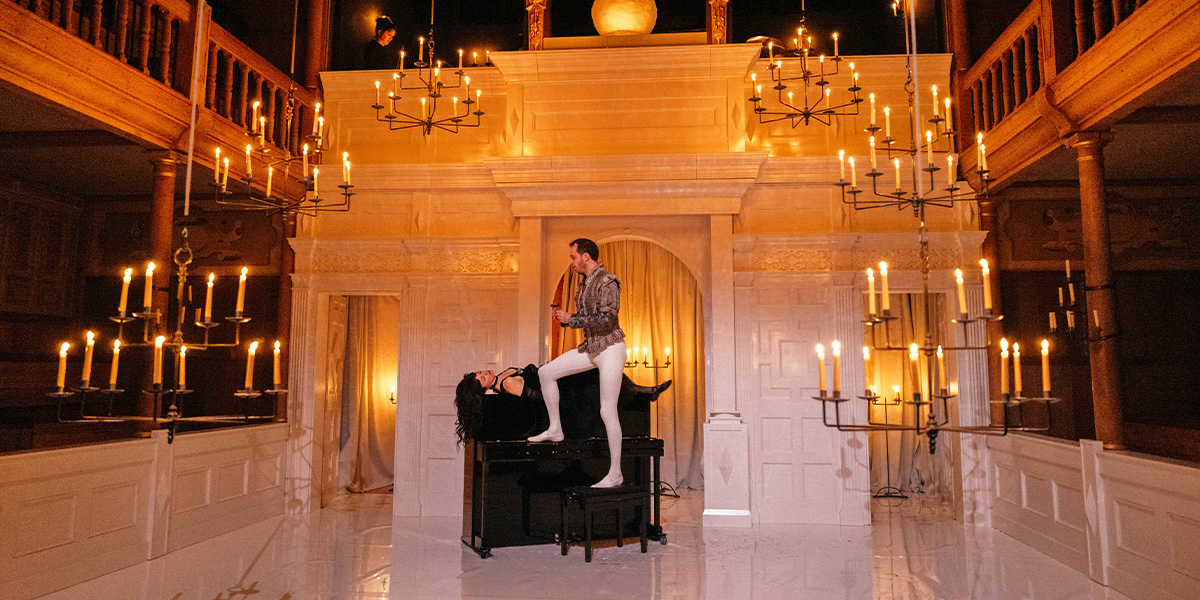 A scene from "A Midsummer Night's Dream" featuring actors in vibrant costumes performing on a stage.