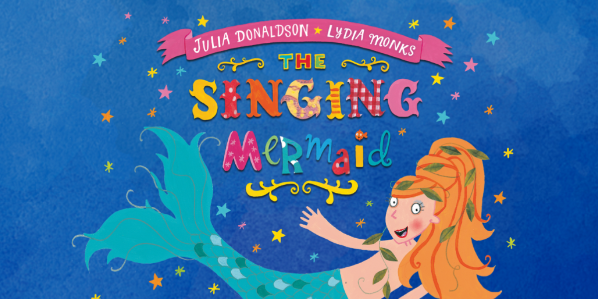 The background is blue. In the centre it reads 'The Singing Mermaid' underneath this is an image of a mermaid with orange hair and a turquoise tail. Small multicoloured stars cover the image