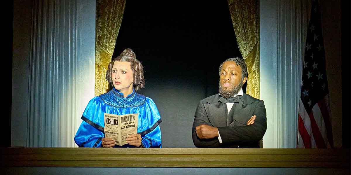 A woman in a blue dress holds a newspaper, while a man in formal attire looks sternly beside her.