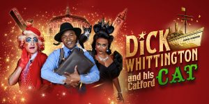 A theatrical scene featuring Dick Whittington and his cat, with vibrant costumes and a colourful stage backdrop.