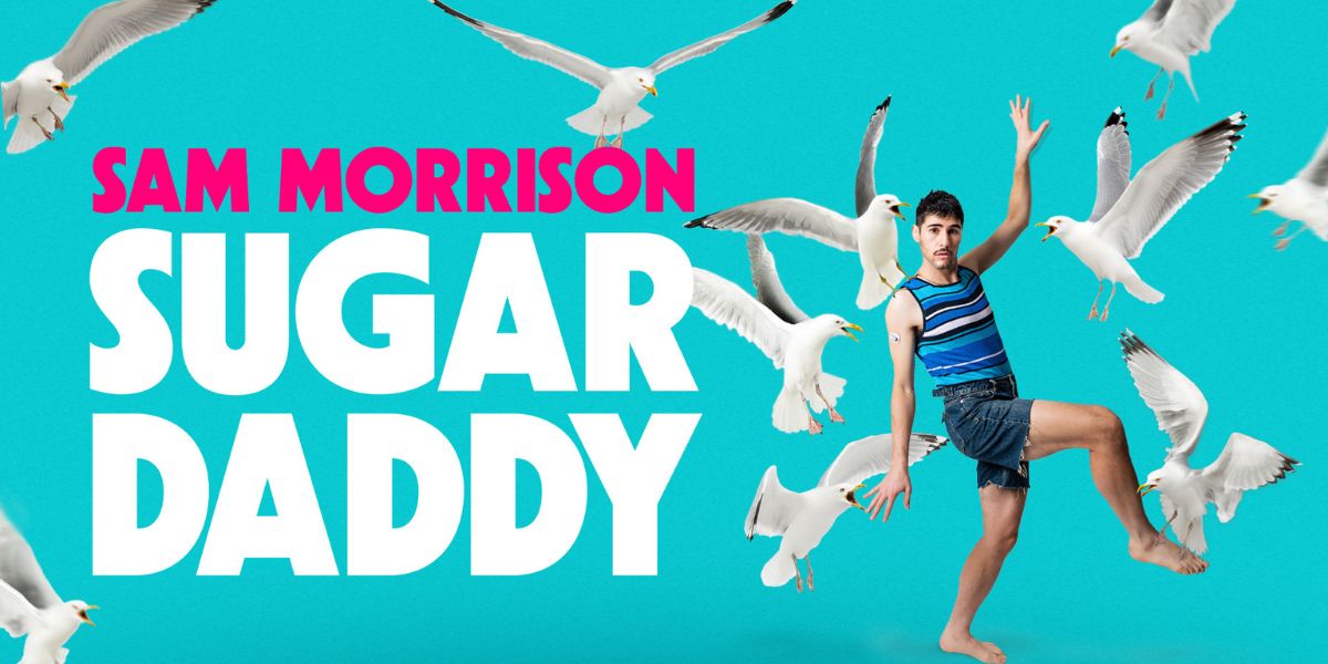 A close-up of a dessert featuring a rich chocolate cake topped with caramel and nuts on a white plate.