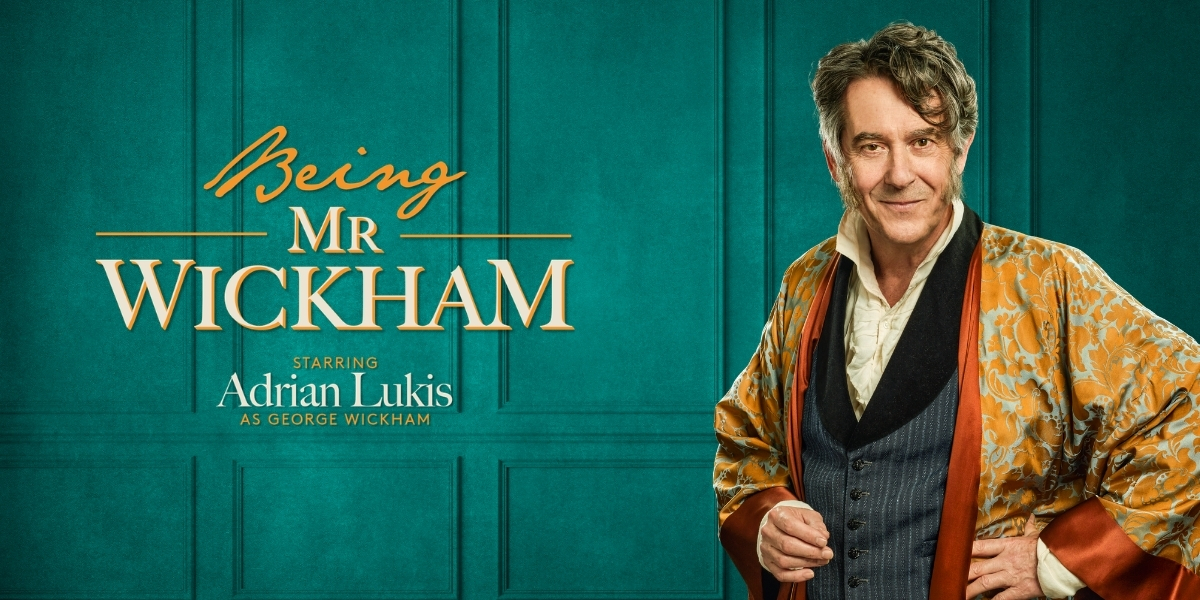 A BMW motorcycle parked on a street, featuring a sleek design in black and silver tones.