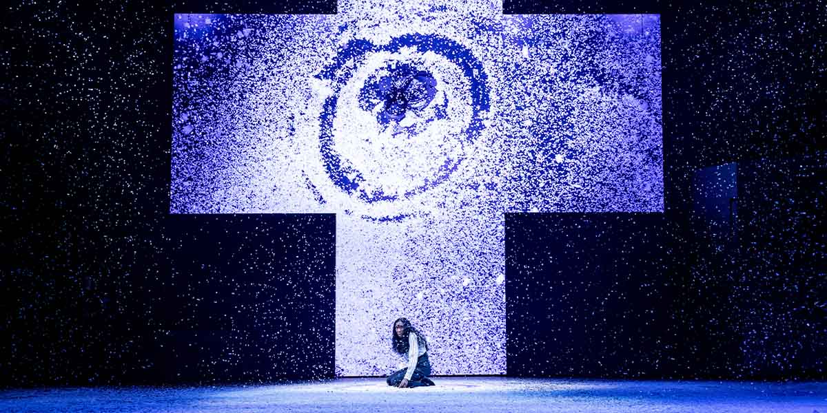 A dramatic scene from Dracula at the Noël Coward Theatre, featuring actors in dark costumes against a moody backdrop.
