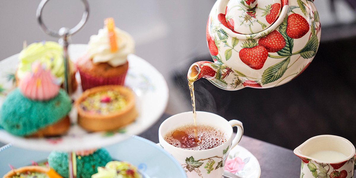 A display of pastries and cakes at Bridget's Bakery, featuring vibrant colours and intricate designs.