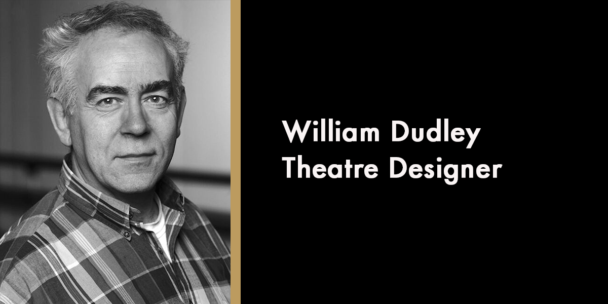 A portrait of William Dudley, smiling, wearing a suit against a neutral background, with a memorial caption.