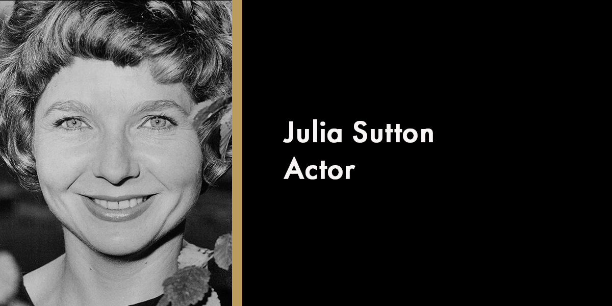 A portrait of Julia Sutton, smiling, with a soft background and warm lighting, commemorating her memory.