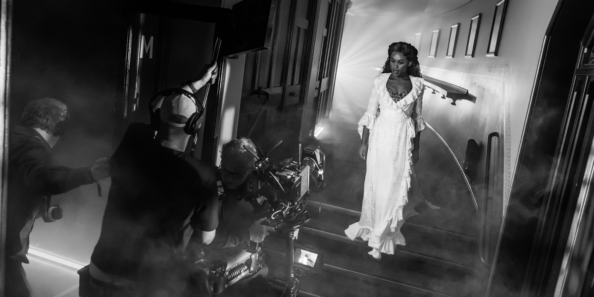 Beatrice Penny-Touré performs at the Olivier Awards 2026, wearing a dramatic costume with theatrical lighting.